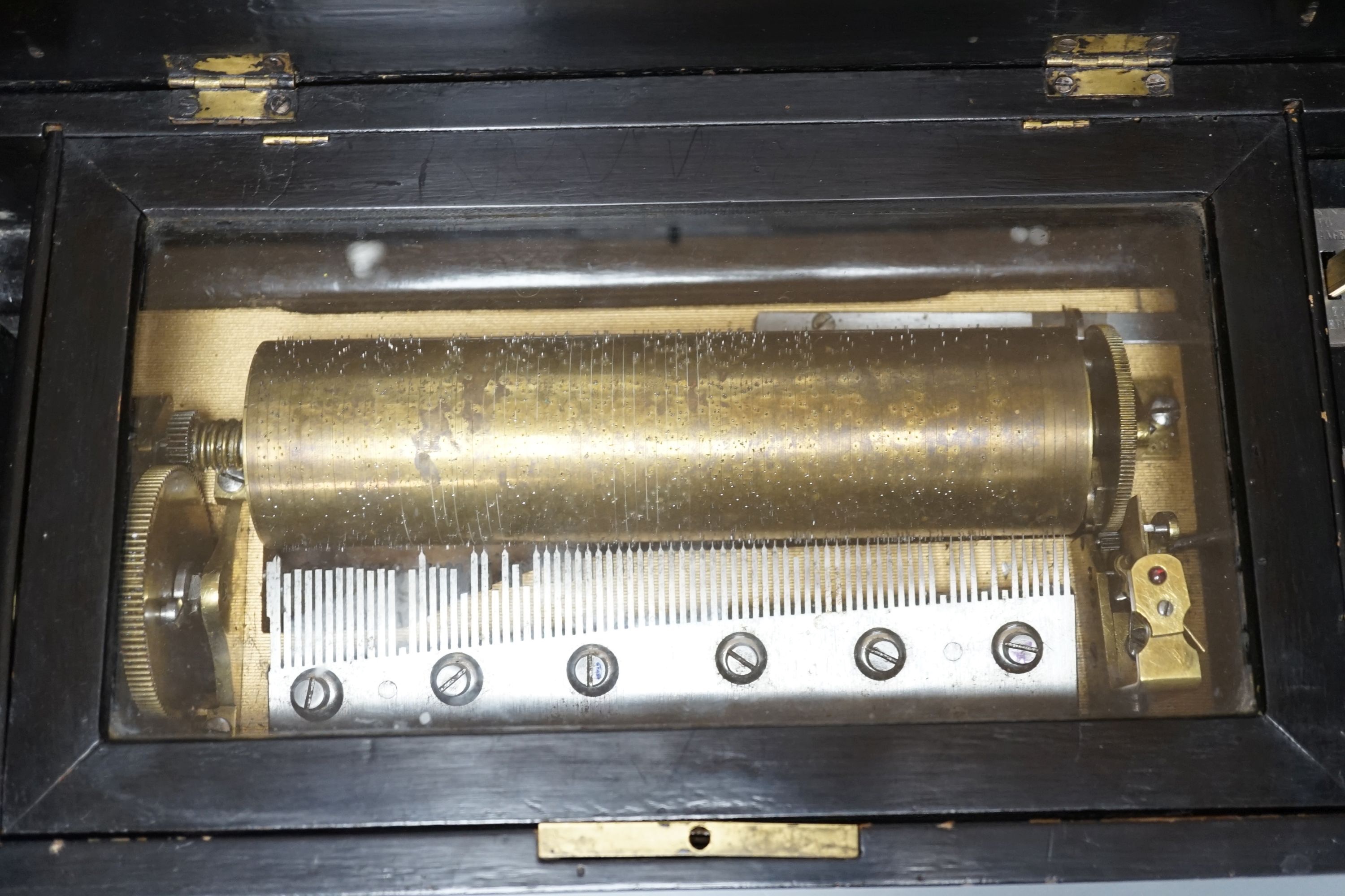A 19th Century Swiss cylinder music box, in inlaid case, 15 x 43cm